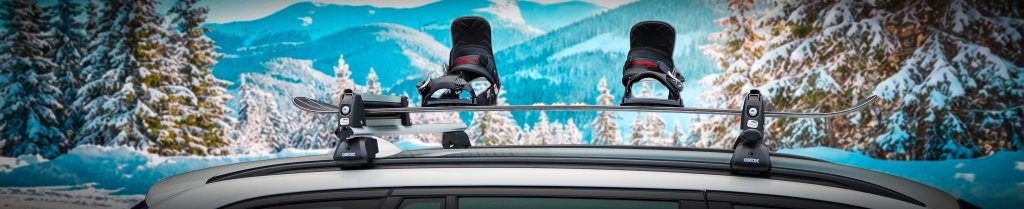Snowboard monterad på skidhållare